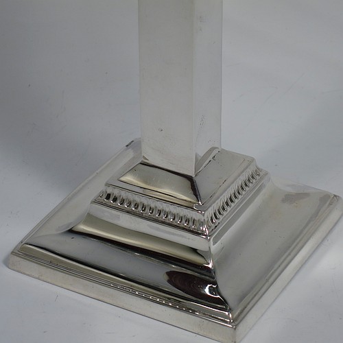 A Sterling Silver Hanukkah Menorah in an Art Deco style, having a plain panelled column, sitting on a stepped base. Made by Britton, Gould and Co., of Birmingham in 1936. The dimensions of this fine hand-made Art Deco silver menorah are height 25.5 cms (10 inches), spread across arms 24 cms (9.5 inches), and it weighs approx. 310g (10 troy ounces). Please note that this item is NOT filled so the whole weight is silver.   