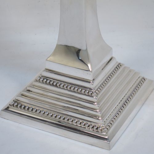 A very elegant Sterling Silver Hanukkah Menorah in an Art Deco style, having a square panelled body with bead-edged borders, a removable Shamus candle holder, and sitting on a pedestal foot. Made by Alexander Smith of Birmingham in 1977. The dimensions of this fine hand-made silver menorah are height 26 cms (10.25 inches), spread across arms 26 cms (10.25 inches), and it weighs approx. 352g (11.4 troy ounces) Please note that this item is not filled so the whole weight is silver.  