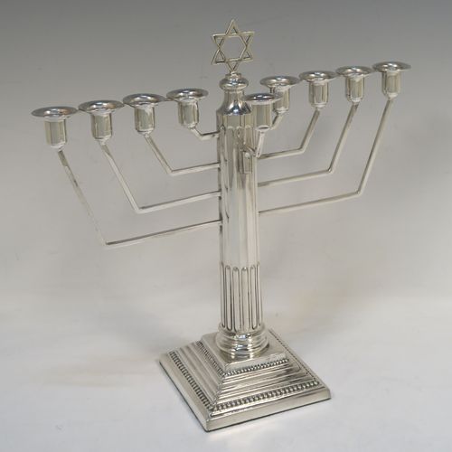 A handsome Sterling Silver Hanukkah Menorah, having a Corinthian style body with a fluted column, a stepped base with bead borders, and a removable Shamus candle holder. This elegant silver menorah was made by Alexander Smith of Birmingham in 1961. The dimensions of this fine hand-made silver menorah are height 25 cms (9.75 inches), and spread across arms 24 cms (9.5 inches), and it weighs approx. 458g (14.8 troy ounces).  