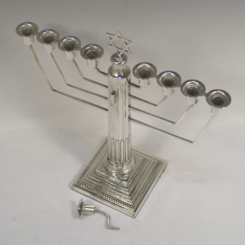 A handsome Sterling Silver Hanukkah Menorah, having a Corinthian style body with a fluted column, a stepped base with bead borders, and a removable Shamus candle holder. This elegant silver menorah was made by Alexander Smith of Birmingham in 1961. The dimensions of this fine hand-made silver menorah are height 25 cms (9.75 inches), and spread across arms 24 cms (9.5 inches), and it weighs approx. 458g (14.8 troy ounces).  