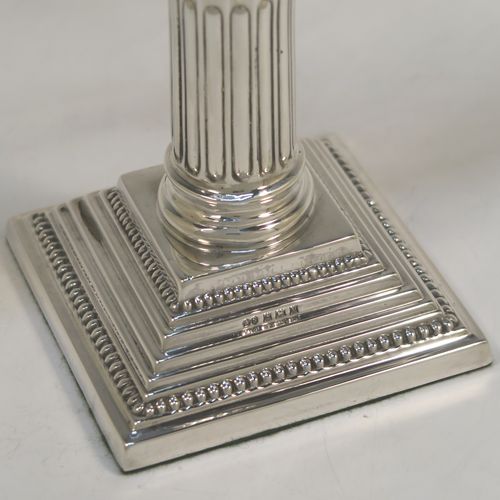 A handsome Sterling Silver Hanukkah Menorah, having a Corinthian style body with a fluted column, a stepped base with bead borders, and a removable Shamus candle holder. This elegant silver menorah was made by Alexander Smith of Birmingham in 1961. The dimensions of this fine hand-made silver menorah are height 25 cms (9.75 inches), and spread across arms 24 cms (9.5 inches), and it weighs approx. 458g (14.8 troy ounces).  