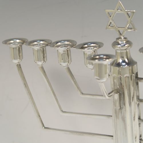 A handsome Sterling Silver Hanukkah Menorah, having a Corinthian style body with a fluted column, a stepped base with bead borders, and a removable Shamus candle holder. This elegant silver menorah was made by Alexander Smith of Birmingham in 1961. The dimensions of this fine hand-made silver menorah are height 25 cms (9.75 inches), and spread across arms 24 cms (9.5 inches), and it weighs approx. 458g (14.8 troy ounces).  