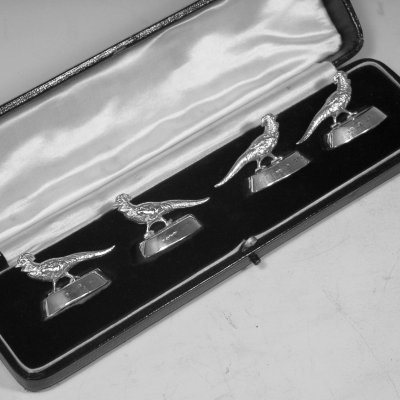 Sterling silver set of four Pheasant place card holders in original box, made in Chester, 1922. Length 4.5 cms.