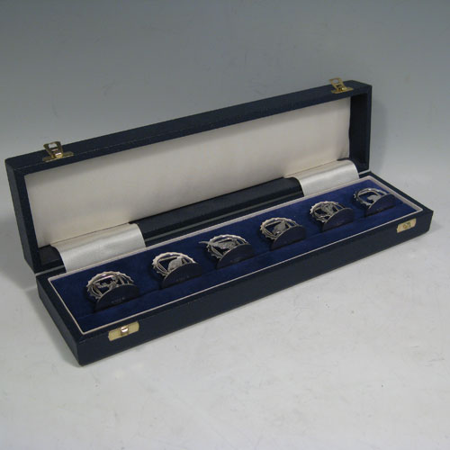 Sterling silver set of six place card holders with a hunting and shooting theme. Each one having a different animal including a retriever dog, pheasant, snipe, duck, partridge, and stag, and all in their original satin and velvet-lined presentation box. Made in London in 2000. Diameter of bases 3 cms (1.3 inches). Total weight approx. 79g (2.5 troy ounces).