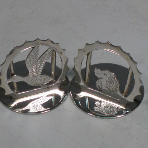 Sterling silver set of six place card holders with a hunting and shooting theme. Each one having a different animal including a retriever dog, pheasant, snipe, duck, partridge, and stag, and all in their original satin and velvet-lined presentation box. Made in London in 2000. Diameter of bases 3 cms (1.3 inches). Total weight approx. 79g (2.5 troy ounces).