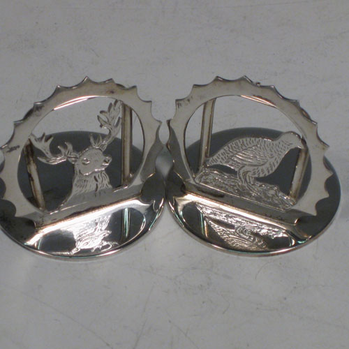 Sterling silver set of six place card holders with a hunting and shooting theme. Each one having a different animal including a retriever dog, pheasant, snipe, duck, partridge, and stag, and all in their original satin and velvet-lined presentation box. Made in London in 2000. Diameter of bases 3 cms (1.3 inches). Total weight approx. 79g (2.5 troy ounces).