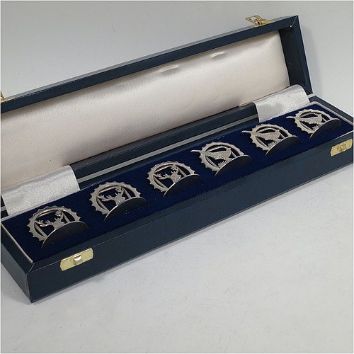 A very handsome Sterling Silver set of six place card holders, each one with either a hand-engraved stag deer or pheasant mounted in a pointed ring on a round base, and all in their original white satin and dark-blue velvet-lined presentation box. Made by J. A. Campbell of London in 1991. The dimensions of this fine set of silver place card holders are diameter of bases 3 cms (1.25 inches), height 3 cms (1.25 inches), and they weigh a total of approx. 79g (2.5 troy ounces).