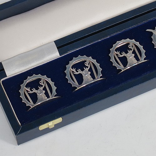 A very handsome Sterling Silver set of six place card holders, each one with either a hand-engraved stag deer or pheasant mounted in a pointed ring on a round base, and all in their original white satin and dark-blue velvet-lined presentation box. Made by J. A. Campbell of London in 1991. The dimensions of this fine set of silver place card holders are diameter of bases 3 cms (1.25 inches), height 3 cms (1.25 inches), and they weigh a total of approx. 79g (2.5 troy ounces).