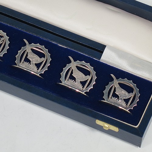 A very handsome Sterling Silver set of six place card holders, each one with either a hand-engraved stag deer or pheasant mounted in a pointed ring on a round base, and all in their original white satin and dark-blue velvet-lined presentation box. Made by J. A. Campbell of London in 1991. The dimensions of this fine set of silver place card holders are diameter of bases 3 cms (1.25 inches), height 3 cms (1.25 inches), and they weigh a total of approx. 79g (2.5 troy ounces).