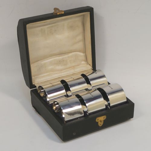 A very handsome Antique Sterling Silver set of six napkin rings, having plain round bodies with straight sides, all in their original cream satin and black velvet-lined presentation box. This elegant set of antique silver napkin rings were made by Walker and Hall of Sheffield in 1915. The dimensions of these fine hand-made antique silver napkin rings are diameter 4 cms (1.5 inches), height 2.5 cms (1 inch), and they weigh a total of approx. 126g (4 troy ounces). Please note that these items are numbered 1 to 6.