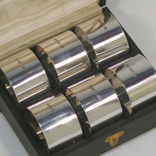 A very handsome Antique Sterling Silver set of six napkin rings, having plain round bodies with straight sides, all in their original cream satin and black velvet-lined presentation box. This elegant set of antique silver napkin rings were made by Walker and Hall of Sheffield in 1915. The dimensions of these fine hand-made antique silver napkin rings are diameter 4 cms (1.5 inches), height 2.5 cms (1 inch), and they weigh a total of approx. 126g (4 troy ounces). Please note that these items are numbered 1 to 6.