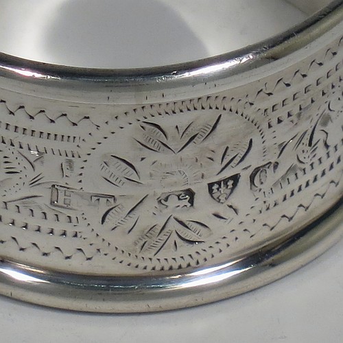 An Antique Victorian Sterling Silver set of six napkin rings, having round bodies with straight sides, hand-engraved floral decoration and vacant round cartouches, with applied plain borders, all in their original purple satin and velvet-lined presentation box. Made by Hilliard and Thomason of Chester in 1897. The dimensions of these fine hand-made antique silver napkin rings are diameter 4 cms (1.5 inches), height 2.5 cms (1 inch), and they weigh a total of approx. 113g (3.6 troy ounces). Please note that the box lock mechanism is slightly damaged.