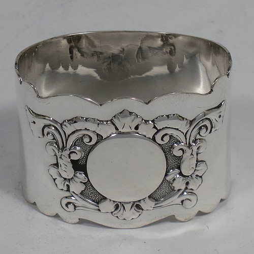 A very pretty Antique Sterling Silver set of six napkin rings, having oval-shaped bodies with hand-engraved floral scroll-work surrounding a vacant cartouche, all in their original dark blue satin and velvet-lined presentation box. Made by George Maudsley Jackson of London in 1895. The dimensions of these fine hand-made antique silver napkin rings are length 5 cms (2 inches), height 3.5 cms (1.3 inch), and they weigh a total of approx. 203g (6.5 troy ounces). Please note that these items are numbered 1 to 6.