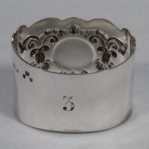 A very pretty Antique Sterling Silver set of six napkin rings, having oval-shaped bodies with hand-engraved floral scroll-work surrounding a vacant cartouche, all in their original dark blue satin and velvet-lined presentation box. Made by George Maudsley Jackson of London in 1895. The dimensions of these fine hand-made antique silver napkin rings are length 5 cms (2 inches), height 3.5 cms (1.3 inch), and they weigh a total of approx. 203g (6.5 troy ounces). Please note that these items are numbered 1 to 6.