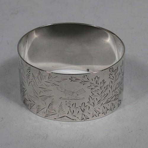 A very pretty Antique Victorian Sterling Silver set of six napkin rings, having oval-shaped bodies with straight sides and hand-engraved ferns and gingko leaves surrounding a cartouche on one side, all in their original maroon satin and velvet-lined presentation box. Made by Edward Hutton of London in 1891. The dimensions of these fine hand-made antique silver napkin rings are length 5 cms (2 inches), height 3 cms (1.25 inch), and they weigh a total of approx. 166g (5 troy ounces). Please note that these items are crested and numbered 1 to 6.   