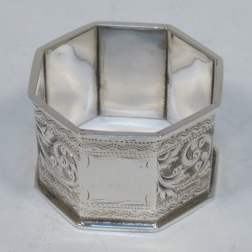 A very pretty Antique Victorian Sterling Silver set of six napkin rings, having octagonal panelled and straight-sided bodies, with hand-engraved floral and scroll decoration, with one panel as a vacant cartouche, and all in their original dark blue  satin and velvet-lined presentation box. Made by the Rolason Brothers of Birmingham in 1897. The dimensions of these fine hand-made antique silver napkin rings are width 4.5 cms (1.75 inches), height 2.5 cms (1 inch), and they weigh a total of approx. 115g (3.7 troy ounces).   