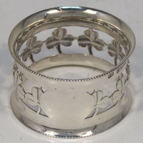 A pretty Antique Edwardian Sterling Silver set of six napkin rings, having round straight-sided bodies, with hand-pierced three-leaf clover Shamrock style decoration, and with bead borders, all in their original dark-blue satin and velvet-lined presentation box. These beautiful silver napkin rings were made by Charles Horner of Birmingham in 1902. The dimensions of these fine hand-made silver napkin rings are diameter 4.5 cms (1.75 inches), height 2.5 cms (1 inch), and they weigh a total of approx. 95g (3.6 troy ounces).   