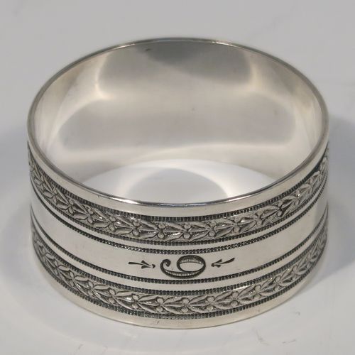 A very pretty Antique Victorian Silver-Plated set of six napkin rings, having round straight-sided bodies, with hand-engraved floral band decoration, and all in their original maroon satin and velvet-lined presentation box. This beautiful set of silver-plated napkin rings were made in ca. 1880. The dimensions of these fine hand-made antique silver plated napkin rings are diameter 4 cms (1.5 inches), and height 2 cms (0.75 inch). Please note that they are numbered with hand-engraved one to six.