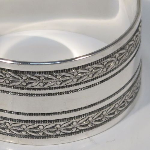 A very pretty Antique Victorian Silver-Plated set of six napkin rings, having round straight-sided bodies, with hand-engraved floral band decoration, and all in their original maroon satin and velvet-lined presentation box. This beautiful set of silver-plated napkin rings were made in ca. 1880. The dimensions of these fine hand-made antique silver plated napkin rings are diameter 4 cms (1.5 inches), and height 2 cms (0.75 inch). Please note that they are numbered with hand-engraved one to six.