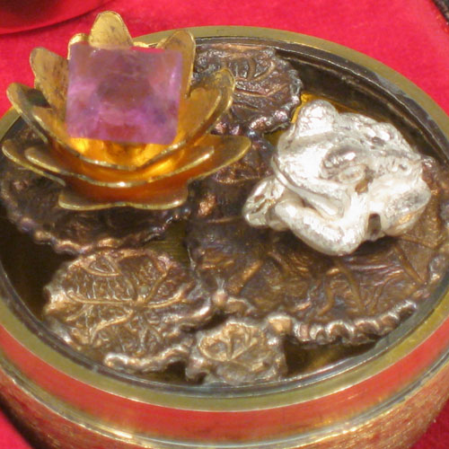 Sterling silver and gold-gilt surprise egg, made by Stuart Devlin of London in 1972. Having inside a frog sitting on lilly pads, together with an amethyst set lilly flower with leaves, all in its original satin and velvet-lined presentation box. This has the style number 28. Height 7.5 cms (3 inches). Total weight approx. 107g (3.5 troy ounces).