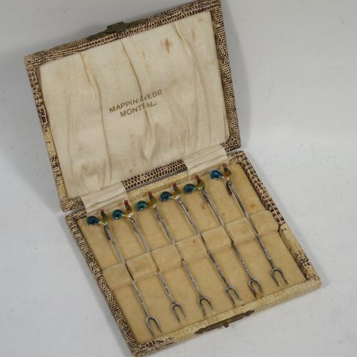 A very stylish Art Deco Sterling silver set of six cocktail sticks, having hand enamelled cockerel mounts and twin toasting fork style ends, all in their original cream satin and velvet-lined presentation box. Made by A. Scott of Birmingham in 1927. The dimensions of this fine hand-made antique silver set of cocktail sticks are length 8.5 cms (3.3 inches), and they weigh a total of approx. 16g (0.5 troy ounces).   