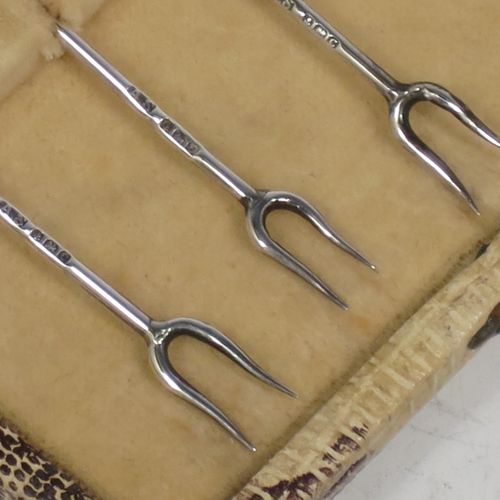 A very stylish Art Deco Sterling silver set of six cocktail sticks, having hand enamelled cockerel mounts and twin toasting fork style ends, all in their original cream satin and velvet-lined presentation box. Made by A. Scott of Birmingham in 1927. The dimensions of this fine hand-made antique silver set of cocktail sticks are length 8.5 cms (3.3 inches), and they weigh a total of approx. 16g (0.5 troy ounces).   