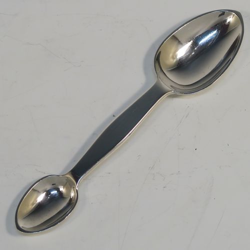 A rare Antique Victorian Sterling Silver double bowled medicine spoon, having a very plain body with oval bowls. This elegant antique silver double-bowled medicine spoon was made by Henry Holland of  London in 1870. The dimensions of this fine hand-made antique silver medicine spoon are length 13.5cms (5.3 inches), and it weighs approx. 29g (0.9 troy ounces).   