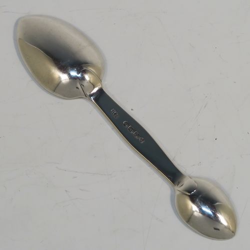 A rare Antique Victorian Sterling Silver double bowled medicine spoon, having a very plain body with oval bowls. This elegant antique silver double-bowled medicine spoon was made by Henry Holland of  London in 1870. The dimensions of this fine hand-made antique silver medicine spoon are length 13.5cms (5.3 inches), and it weighs approx. 29g (0.9 troy ounces).   