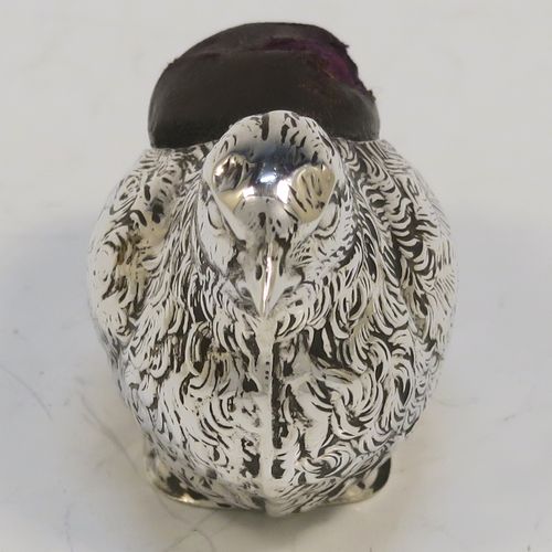 A very pretty and rare Antique Sterling Silver pin cushion, in the form of a hen chick, with hand-chased body and face, and a leather covered cushion. This interesting antique silver pin cushion was made by Sampson and Mordan of Birmingham in 1914. The dimensions of this fine hand-made antique silver pin cushion are length 5 cms (2 inches), width 2.5 cms (1 inch), and height 2.5 cms (1 inch). Please note that the cushions leather covering is slightly damaged.