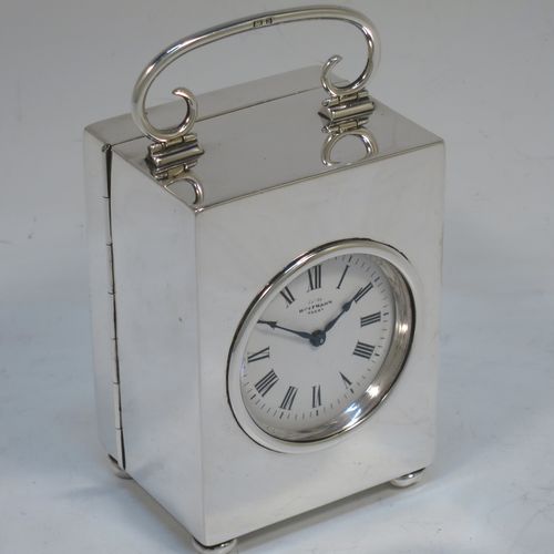 A very handsome Antique Victorian Sterling Silver carriage clock, having a very plain rectangular upright body, with a hinged back door opening to the original clock movement mechanism and winder, a hinged and scrolled top carrying handle, and all sitting on four cushion feet. Made by George Bower of Birmingham in 1900. The dimensions of this fine hand-made antique silver carriage clock are height 9 cms (3.5 inches), width 6.5 cms (2.5 inches), and depth 5 cms (2 inches). Please note that this clock has been serviced and works properly.  