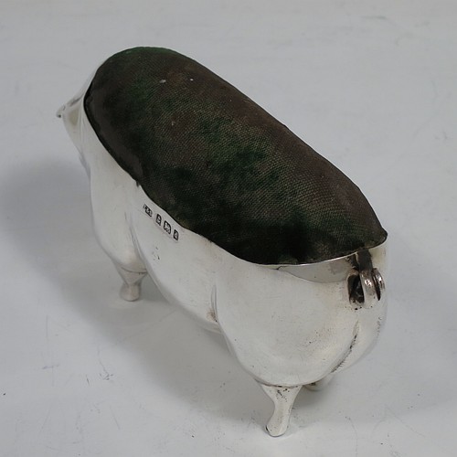 A handsome and unusually large Antique Edwardian Sterling Silver pin cushion, in the form of a pig with a dark green velvet covered pin cushion along its back. Made by Levi and Salaman of Birmingham in 1903. The dimensions of this fine hand-made antique silver Pig pin cushion are length 6 cms (2.3 inches), width 3 cms (1.25 inches), an height 5.5 cms (2.25 inches). Please note that the green velvet is discoloured.     