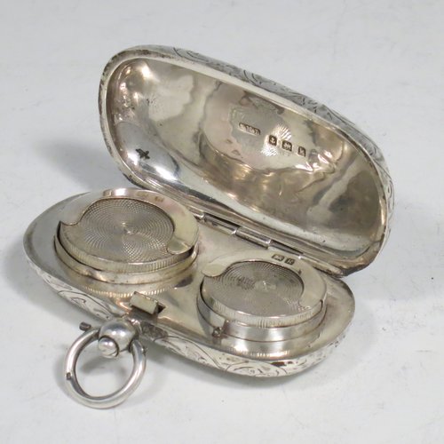 An Antique Edwardian Sterling Silver double Sovereign case, having a rectangular body with rounded corners and hand-engraved floral decoration, with a hinged lid, and internal sprung mechanisms which are in working order, and a push-button clasp with ring. All made by Samuel M. Levi of Birmingham in 1909. The dimensions of this fine hand-made antique silver sovereign case are length 6 cms (2.3 inches), width 3.5 cms (1.3 inches), and it weighs 36g (1.2 troy ounces).   