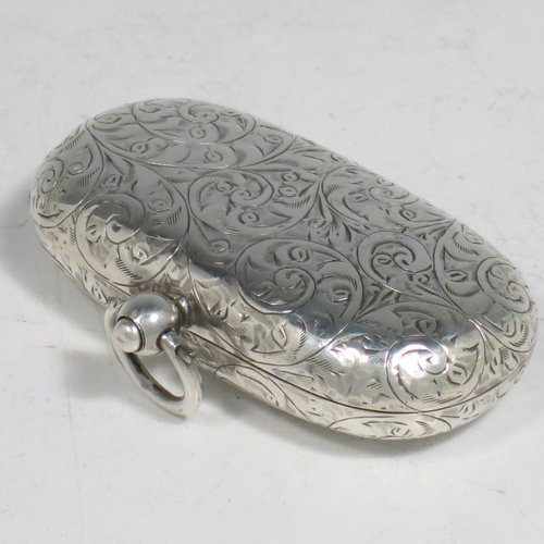 An Antique Edwardian Sterling Silver double Sovereign case, having a rectangular body with rounded corners and hand-engraved floral decoration, with a hinged lid, and internal sprung mechanisms which are in working order, and a push-button clasp with ring. All made by Samuel M. Levi of Birmingham in 1909. The dimensions of this fine hand-made antique silver sovereign case are length 6 cms (2.3 inches), width 3.5 cms (1.3 inches), and it weighs 36g (1.2 troy ounces).   