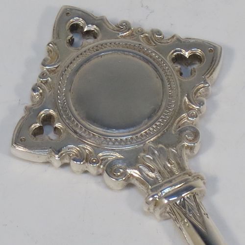 A handsome Sterling Silver 21st key to life, having a cast body with a hand-chased Gothic style handle, a plain shank, hand-chased collars, and a plain key bit, all in its original cream satin and dark-blue velvet-lined presentation box. Made by Vaughton and Sons of Birmingham in 1932. The dimensions of this fine hand-made silver 21st key to life are length 11 cms (4.3 inches) and it weighs approx. 43g (1.4 troy ounces).  