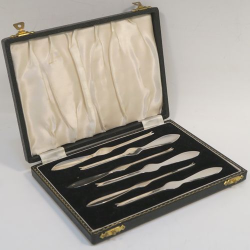 An elegant set of six Lobster picks in a very plain style, all in their original white satin and black velvet-lined presentation box. These handsome silver lobster picks were made by William Suckling of Birmingham in 1960. The dimensions of these fine hand-made silver lobster picks are length 12.5 cms (5 inches), and they weigh a total of 98g (3.2 troy ounces).  