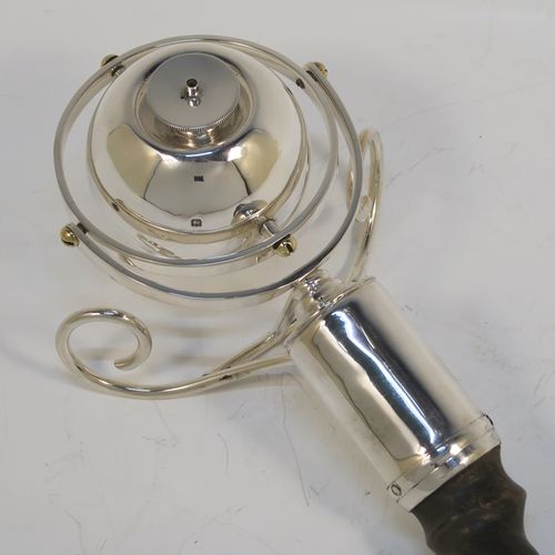 A very elegant Sterling Silver mounted and horn or antler table lighter, having a gimble mounted lighter, sitting on two scroll wire-work feet, with the lighter always remaining upright whichever angle is used, and all in original fine condition. This handsome and very unusual silver table lighter was made by Padgett and Braham of London in 1929. The dimensions of this fine hand-made silver and antler table lighter are length 39 cms (15.25 inches), and width 10 cms (4 inches).