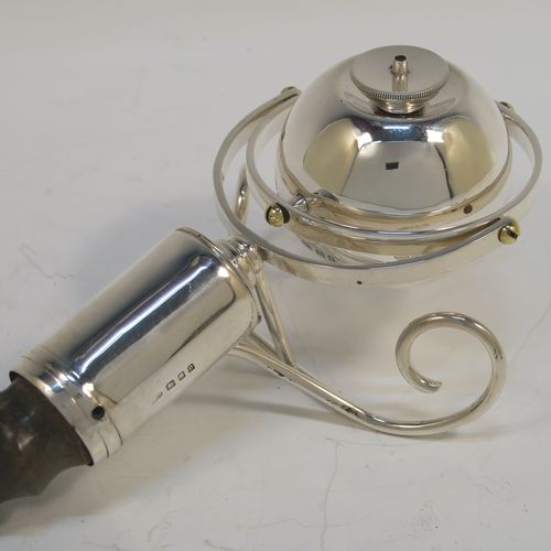 A very elegant Sterling Silver mounted and horn or antler table lighter, having a gimble mounted lighter, sitting on two scroll wire-work feet, with the lighter always remaining upright whichever angle is used, and all in original fine condition. This handsome and very unusual silver table lighter was made by Padgett and Braham of London in 1929. The dimensions of this fine hand-made silver and antler table lighter are length 39 cms (15.25 inches), and width 10 cms (4 inches).