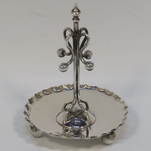 A very pretty Antique Edwardian Sterling Silver ring tree, having a central tree with wire loops for rings, sitting on a round base with three ball feet. This beautiful silver ring tree and base was made in Birmingham in 1909. The dimensions of this fine hand-made antique silver tree ring are height 8 cms (3 inches), diameter 6.5 cms (2.5 inches), and it weighs approx. 40g (1.3 troy ounce).  