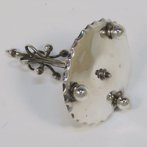 A very pretty Antique Edwardian Sterling Silver ring tree, having a central tree with wire loops for rings, sitting on a round base with three ball feet. This beautiful silver ring tree and base was made in Birmingham in 1909. The dimensions of this fine hand-made antique silver tree ring are height 8 cms (3 inches), diameter 6.5 cms (2.5 inches), and it weighs approx. 40g (1.3 troy ounce).  