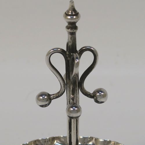 A very pretty Antique Edwardian Sterling Silver ring tree, having a central tree with wire loops for rings, sitting on a round base with three ball feet. This beautiful silver ring tree and base was made in Birmingham in 1909. The dimensions of this fine hand-made antique silver tree ring are height 8 cms (3 inches), diameter 6.5 cms (2.5 inches), and it weighs approx. 40g (1.3 troy ounce).  