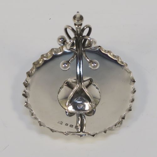 A very pretty Antique Edwardian Sterling Silver ring tree, having a central tree with wire loops for rings, sitting on a round base with three ball feet. This beautiful silver ring tree and base was made in Birmingham in 1909. The dimensions of this fine hand-made antique silver tree ring are height 8 cms (3 inches), diameter 6.5 cms (2.5 inches), and it weighs approx. 40g (1.3 troy ounce).  