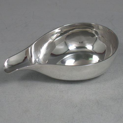 Antique Georgian sterling silver pap boat made by Henry Morris of London in 1750 (with a set of contemporaneous initials). Length 11 cms.