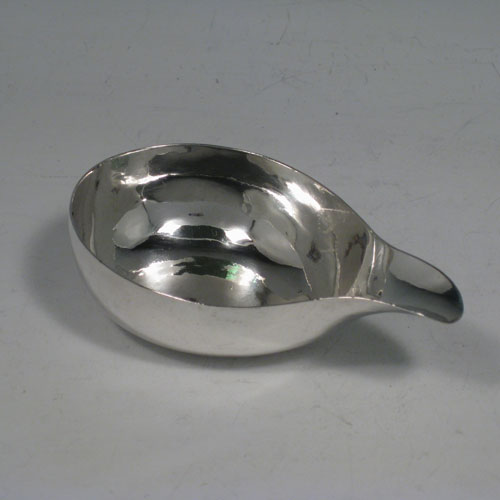 A rare Antique Georgian Sterling Silver pap boat, having a very plain oval unadorned body. This handsome antique silver pap boat was made in London in 1746. The dimensions of this fine hand-made antique silver pap boat are length 11 cms (4.25 inches), width 6.5 cms (2.5 inches), and it weighs approx. 45g (1.5 troy ounces).
