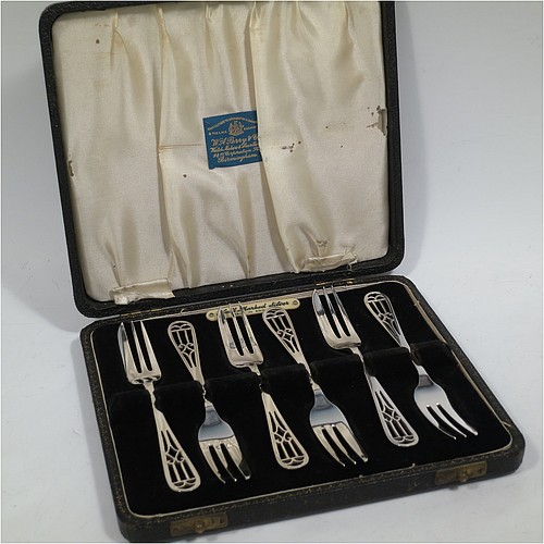 A very pretty and unusual Sterling Silver set of six pastry forks, having hand-pierced handles, and three tined forks, all in their original cream satin and black velvet-lined presentation box. Made by Angora Silver Co., of Birmingham in 1949. The dimensions of these fine hand-made silver pastry forks are length 13.5 cms (5.25 inches), and they weigh a total of 104g (3.4 troy ounces). Please note that the interior satin straps that cover the hinges are damaged.   