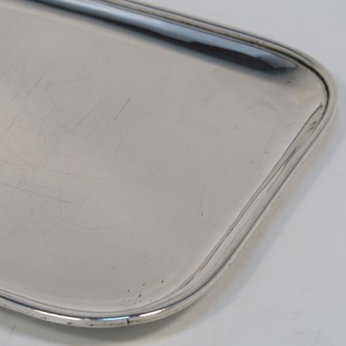 A very handsome Antique Georgian Sterling Silver pen tray, having a very plain rectangular body with rounded corners and an applied reeded border, and all sitting on a flat base. This elegant antique silver pen tray was made by John Mewburn of London in 1792. The dimensions of this fine hand-made antique silver pen tray are length 23 cms (9 inches), width 15 cms (6 inches), and it weighs approx. 276g (9 troy ounces). Please note that this item is crested. 