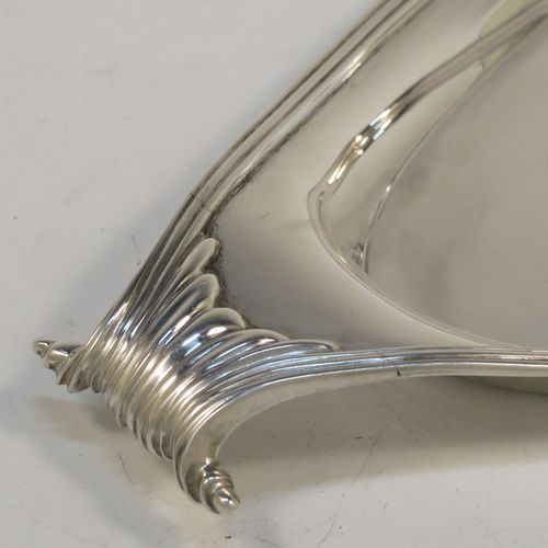 A very elegant Antique Victorian Sterling Silver pen tray, having a very plain oval body with applied reeded borders, cast scrolled handles at either end, and all sitting on a flat base. This beautiful antique silver pen tray was made by D. and J. Welby of London in 1893. The dimensions of this fine hand-made antique silver pen tray are length 23 cms (9 inches), width 10 cms (4 inches), and it weighs approx. 152g (4.9 troy ounces).   