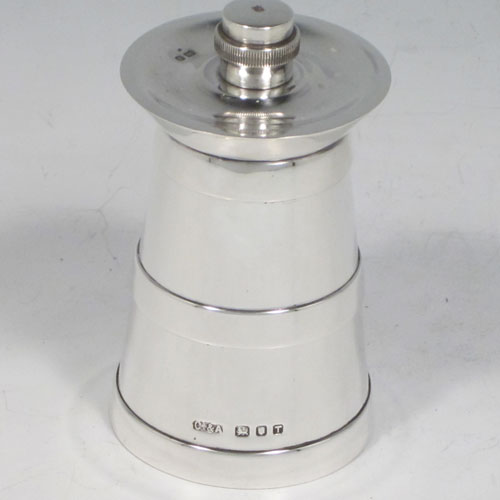 Sterling silver pair of pepper grinders, having plain tapering straight sided bodies with three applied bands, with knurled grinder finials, and both having good quality grinder mechanisms that work properly. Made by Collett and Anderson of London in 1954. The dimensions of these fine hand-made silver pepper grinders are height 8 cms (3 inches), and diameter at base 4.5 cms (1.75 inches).  