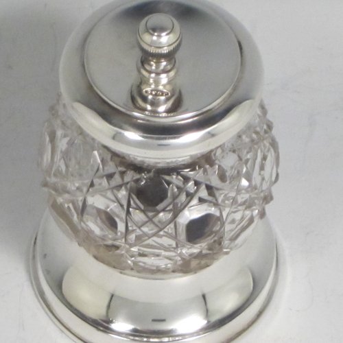 Antique Edwardian sterling silver and hand-cut crystal pepper grinder, having a round body with hobnail-cut pattern, plain round mounts top and bottom, and an original Peugeot grinding mechanism. Made John Grinsell of Birmingham in 1905. The dimensions of this fine hand-made silver and crystal pepper grinder are height 9 cms (3.5 inches), and diameter at base 6 cms (2.25 inches).    