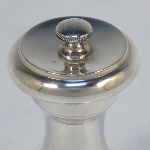 An Antique Victorian Sterling Silver pepper grinder, having a plain round baluster body, an original Peugeot grinder mechanism, and a knurled finial. Made by Mitchell Bosley of Birmingham in 1899. The dimensions of this fine hand-made antique silver pepper grinder are height 9 cms (3.5 inches), diameter at base 4.5 cms (1.75 inches), and it weighs approx. 96g (3 troy ounces).  