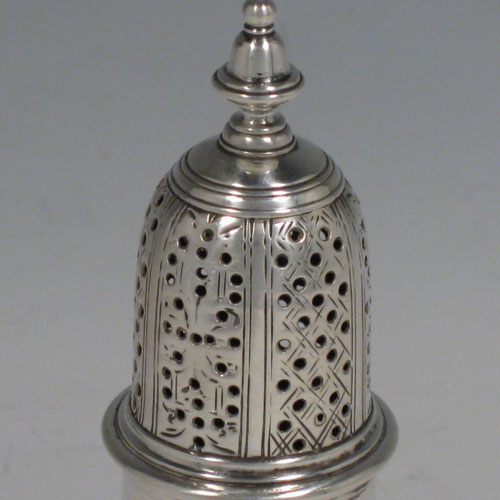 Antique Georgian sterling silver pepper pot, having a plain baluster body, and sitting on a pedestal foot. Made by Albartus Schuman of London in 1762. Height 14 cms (5.5 inches), diameter of main body 5 cms (2 inches). Weight approx. 115g (3.7 troy ounces). Please note that this item is crested.